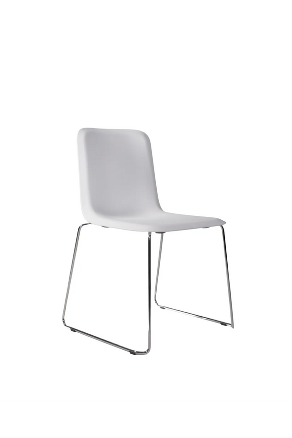 THIS 141 PP CHAIR - Stackable - white chrome, white shell on a polished chrome sled base, angled view