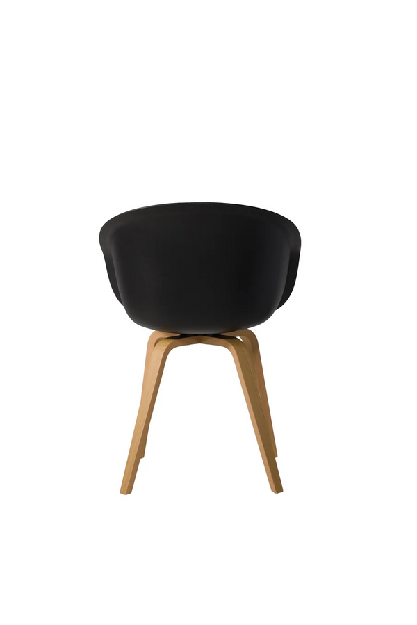 This Bucket Chair 101 - wood frame - black seen from behind, black shell above splayed oak legs